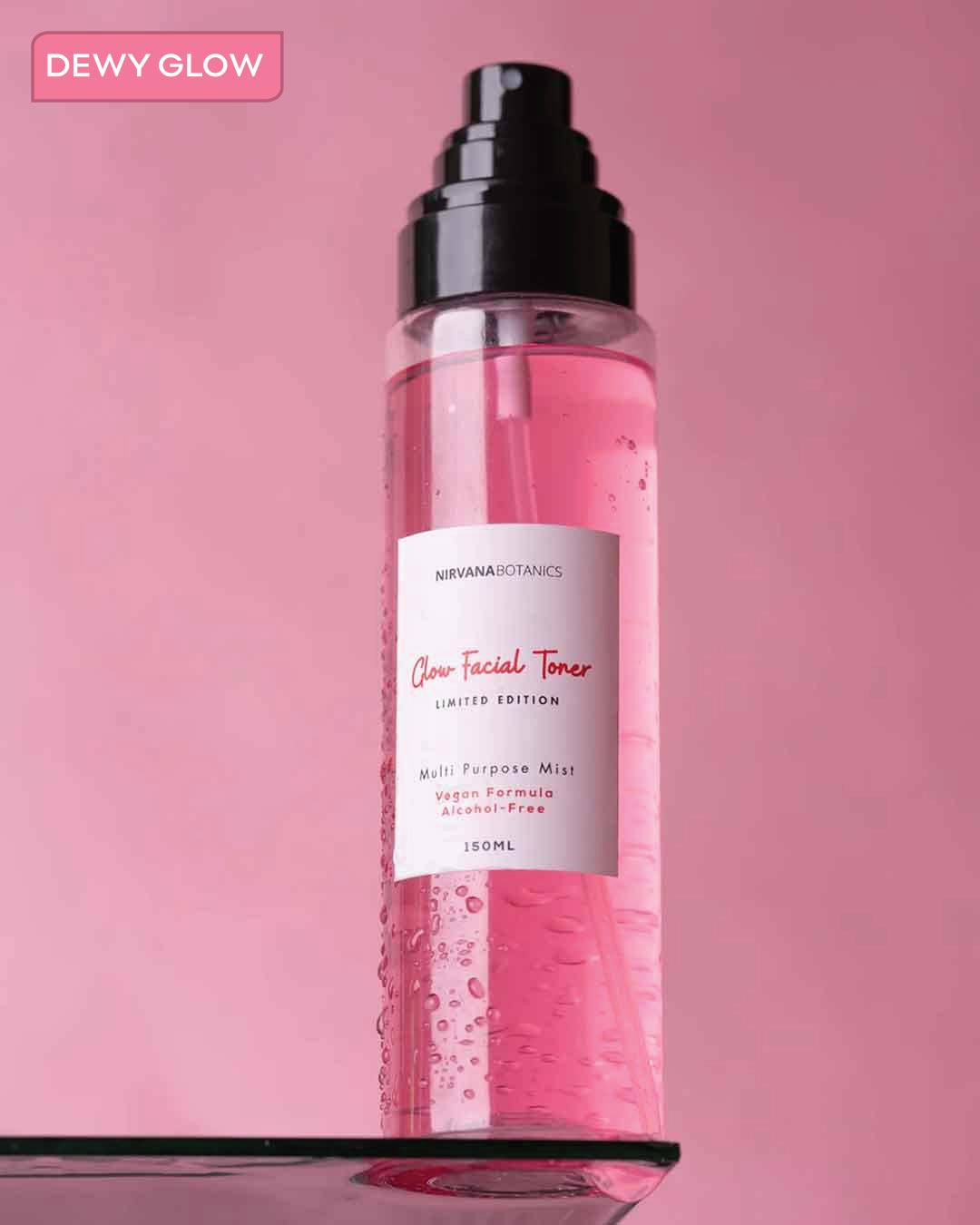 Facial toner bottle with pink liquid on a pink background