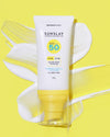 A pump bottle of SunSlay Sunscreen Fluid SPF 50 with a yellow and white color scheme on a yellow background.
