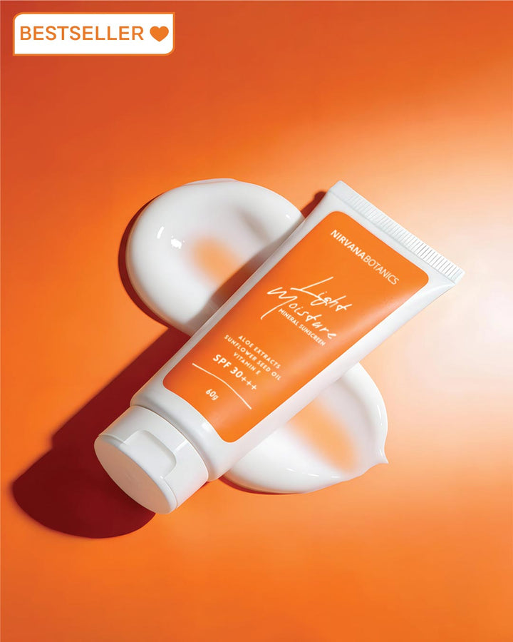 Sunscreen tube with white cap on an orange background